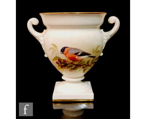 A Royal Worcester twin handled pedestal vase decorated by Powell with a hand painted bullfinch perched on a branch, signed, b