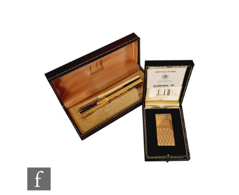 A cased Dunhill 70 gold plated lighter with instruction booklet, with a cased Dunhill fountain pen with guarantee and a Dunhi