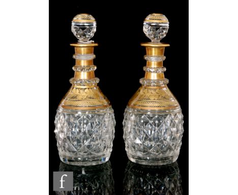 A pair of French Charles X glass decanters by Baccarat, circa 1830, each of ovoid form moulded in a diamond pattern, below gi