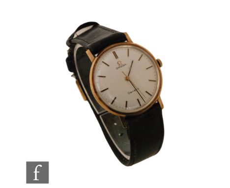 A gentleman's 9ct hallmarked Omega Geneve manual wind wrist watch, batons to a circular silvered dial, case diameter 34mm, mo