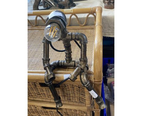 A novelty metal articulated table lamp 