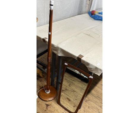 A Danish mid century teak mirror with bevelled edge glass and a mid century wooden standard lamp, shipping unavailable 