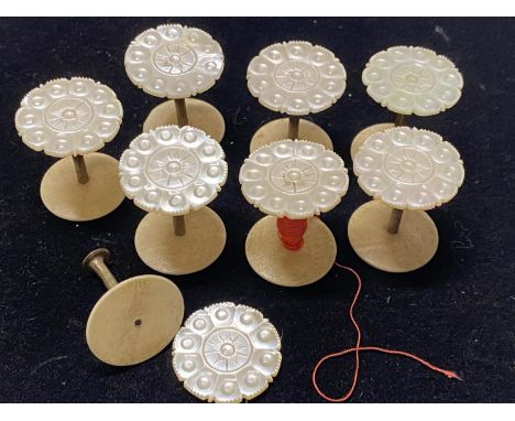 A selection of 19th century mother of pearl cotton reel bobbins 