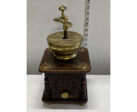 A antique wooden and brass coffee grinder 