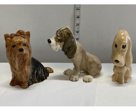 Two Slyvac ceramic dog figurines and one other 
