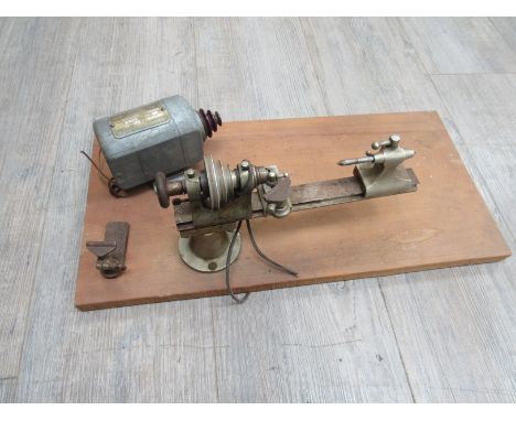 An 8mm watchmaker's lathe, with tool rests, tailstock and centre, motor. All for restoration
