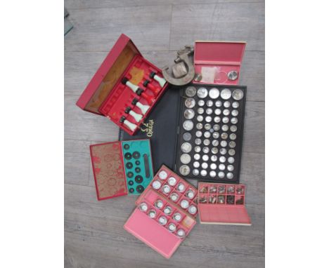 A collection of mainly Omega watch casing tools, parts for various calibres, cases and dials including Speedmaster and Seamas