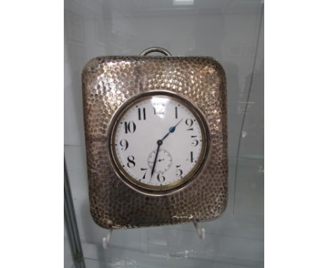 A Goliath pocket watch, with Arabic enamelled dial in an easel-backed display stand with planished metal front. watch case 10
