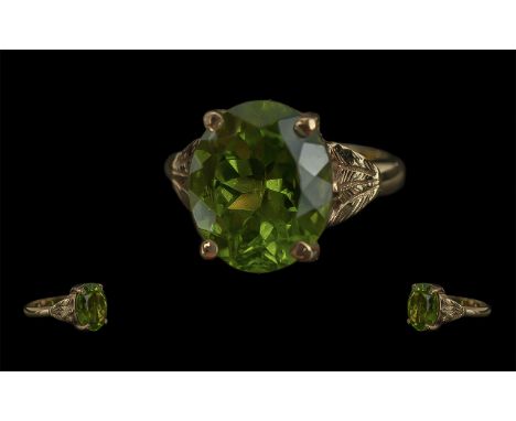 Ladies - Pleasing 9ct Gold Single Stone Peridot Set Dress Ring, Full Hallmark to Interior of Shank. The Large Oval Shaped Fac