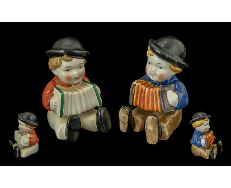 Early Hummel Pair of Hand Painted Figures. Comprises 1/ Boy with Accordion Wearing Black Hat Blue Jacket, Orange Accordions. 