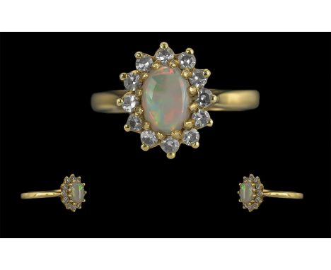 Ladies 18ct Gold Pleasing Opal and Diamond Set Cluster Ring, Full hallmark to Interior of Shank. The Central Opal Surrounded 