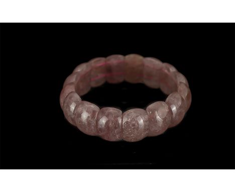 Strawberry Quartz Bracelet, curved beads of the unusual and attractive, deep pink, translucent strawberry quartz, threaded on