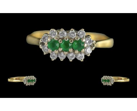 Ladies Contemporary 18ct Gold Emerald and Diamond Set Dress Ring. Full Hallmark to Interior of Shank. The Emeralds and Diamon