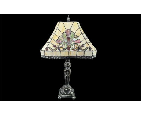 Large Tiffany Style Table Lamp, with pink cream and green decoration, raised on a heavy decorative metal base.  Measures appr