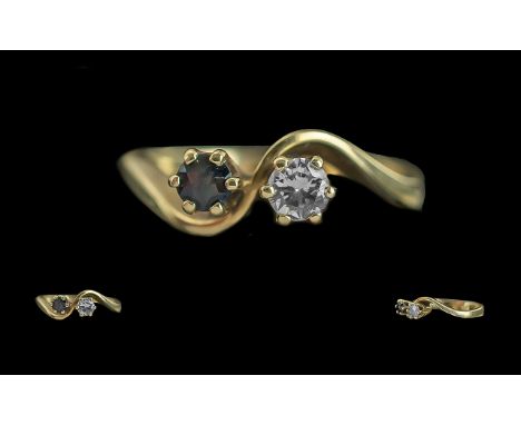 Ladies Attractive 14ct Gold Two Stone Diamond and Sapphire Set Ring. Marked 585 to Interior of Shank. The Brilliant Cut Round