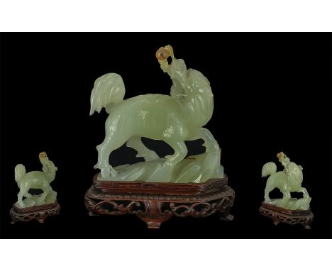 Jade Carving of a mythical Foo Dog, raised on a stand.  Height 6.5'' x 6''.
