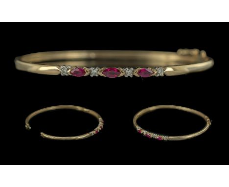 Ladies Pleasing and Attractive Ruby and Diamond Set Hinged Bangle. Marked 9ct to Interior of Band. The Rubies of Excellent Co