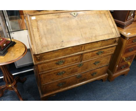 Georgian walnut bureau having fall front with fitted interior above two over two drawers raided on bracket feet, 91cm wide 
