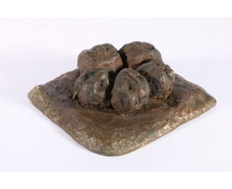 An unusual bronze casting of five lumps of camel dung, 19cm x 17cm 