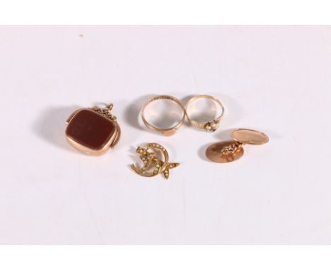 9ct gold buckle ring 1.9g, a 9ct gold cufflink 3.0g, an unhallmarked ruby and seed pearl ring 1.5g, 9ct gold seed pearl part 