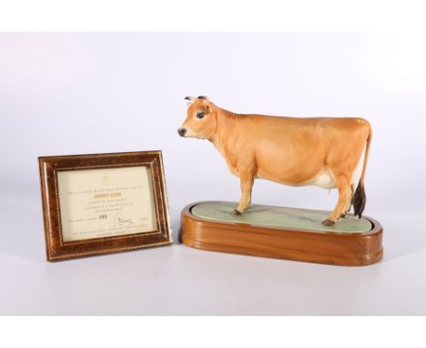 Royal Worcester porcelain model of a Jersey Cow modelled by Doris Lindner on wooden plinth base with certificate of authentic