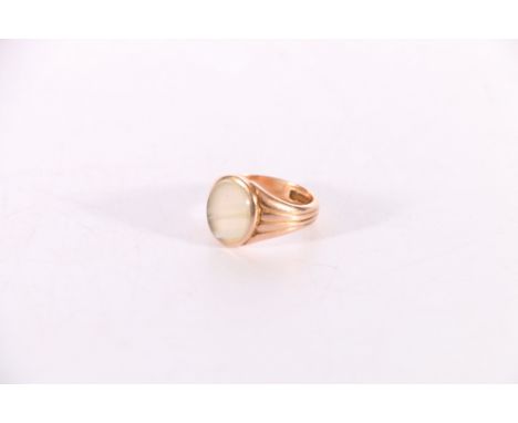 9ct gold signet style ring with oval white quartz cabochon, size O/P, 6.3g gross.Crack through centre of stone.  Stone dirty.