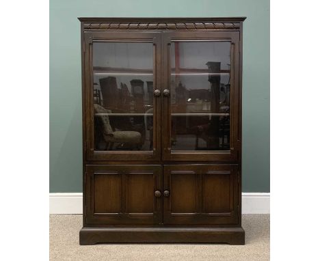 PLUS LOT 22 - BELIEVED ERCOL BOOKCASE CUPBOARD, two glazed upper doors over two cupboard doors, 138 (h) x 101 (w) x 29cms (d)