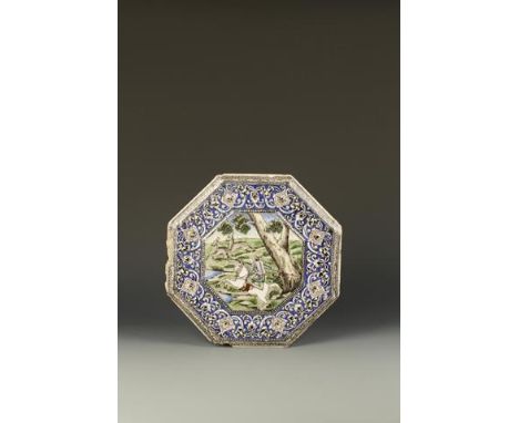 A QAJAR POLYCHROME OCTAGONAL TILE showing a figure hunting deer on horseback in a landscape, within a foliate border, 19th ce