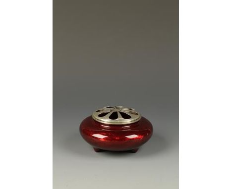 A JAPANESE WIRELESS CLOISONNÉ TRIPOD KORO of compressed circular form, decorated with a writhing dragon amongst waves beneath