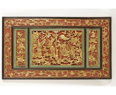 A PAIR OF CHINESE GILTWOOD PANELS, the central area showing narrative scenes with figures on horseback and attendants, within