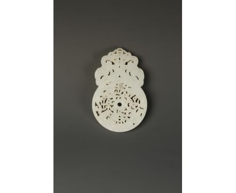 A CHINESE WHITE JADE ARCHAISTIC BI-FORM PENDANT, the symmetrical dragon scroll top above the lower disc, pierced with 'chang 
