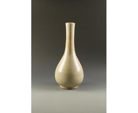 A LARGE CHINESE KIANGNAN PEAR-SHAPED VASE with a long neck, covered in a creamy 'ostrich egg' glaze with fine crackles, one s