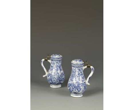 A PAIR OF CHINESE BLUE AND WHITE SMALL TANKARDS of baluster form, the rounded lower bodies decorated with flowers, beneath pe