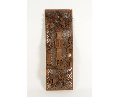 A SET OF FIVE CHINESE CARVED AND FRET WOOD PANELS, each showing a central vase of flowers surrounded by further objects on a 