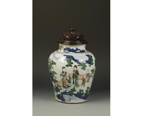 A LARGE CHINESE WUCAI 'NARRATIVE' JAR, the rounded tapering body decorated with figures in a garden landscape watching childr