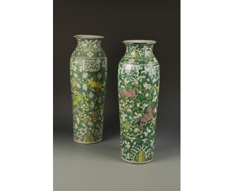 A PAIR OF LARGE CHINESE FAMILLE VERTE VASES of slender tapering form, decorated with mythical creatures amongst blossoming fo