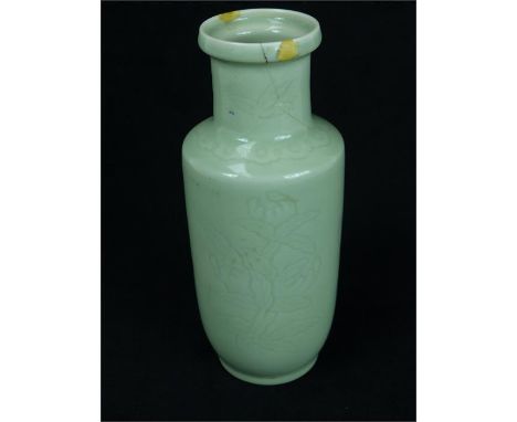 A Chinese celadon porcelain vase decorated with incised foliate detail, formerly converted to a lamp, drilled to the base (a/