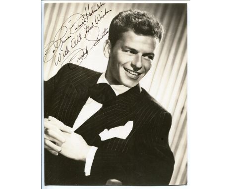 An autographed black and white photograph signed by Frank Sinatra and inscribed 'For Prince Francis Hohenlohe, with all good 