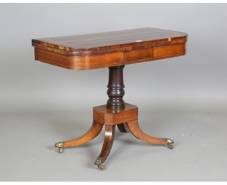 A Regency rosewood and satinwood crossbanded fold-over card table, height 73cm, width 91cm, depth 45cm (some faults).Buyer’s 