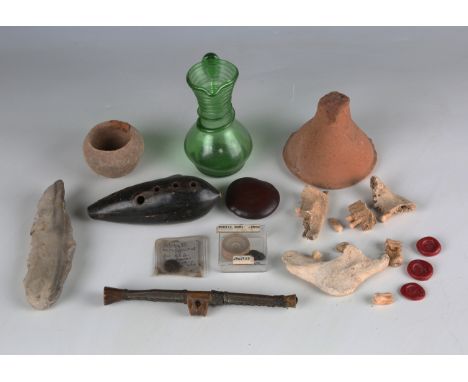 A group of antiquities and other collectors' items, including a Paleolithic flint fabricator tool, length 15cm, an African wi