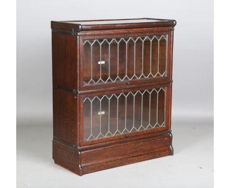 An early 20th century oak two-section leaded glazed Globe Wernicke bookcase, height 106cm, width 87cm, depth 38cm.Buyer’s Pre