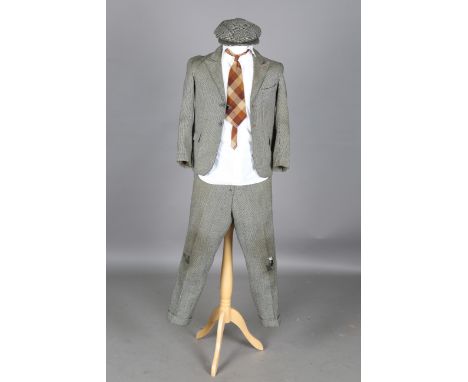 A Norman Wisdom 'Gump Suit' made by W. Snape &amp; Son, Wolverhampton in June, 1956, together with original cap, shirt and ti