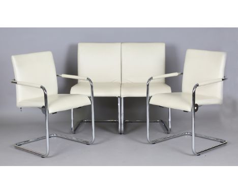 A set of four Hulsta D2 chairs, upholstered in cream leather and supported on chromium plated tubular frames, comprising two 