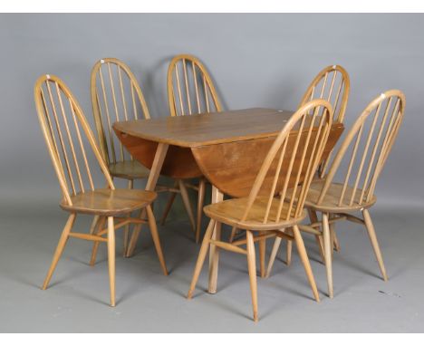 A set of six Ercol Windsor dining chairs, height 97cm, width 43cm, and an Ercol drop-flap table, width 113cm.Buyer’s Premium 