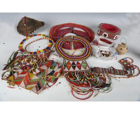 A collection of Masai bead jewellery, including five circular necklaces, various bracelets and other beadwork.Buyer’s Premium