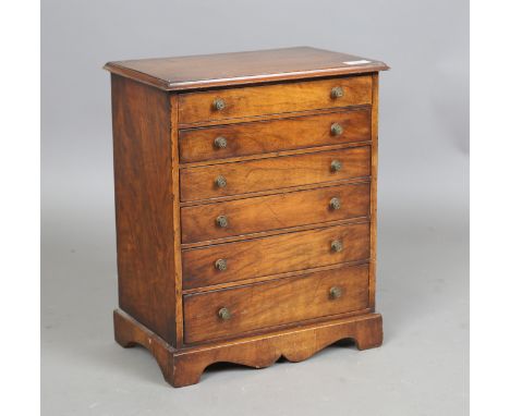 A Victorian walnut table-top chest of six drawers, height 45cm, width 37cm, depth 24cm.Buyer’s Premium 29.4% (including VAT @