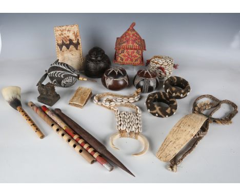 A collection of ethnic jewellery and other related items, including copper and brass bangles, three cowrie shell applied neck