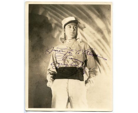 An autographed sepia photograph signed by Gary Cooper and inscribed 'Greetings to Alexa from Gary Cooper', 25.5cm x 20.5cm.Bu