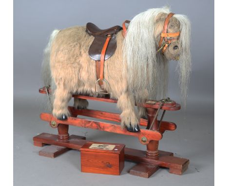 A late 20th century Thelwell pony rocking horse by Kings Horses, the stand bearing maker's label, height 100cm, length 116cm,