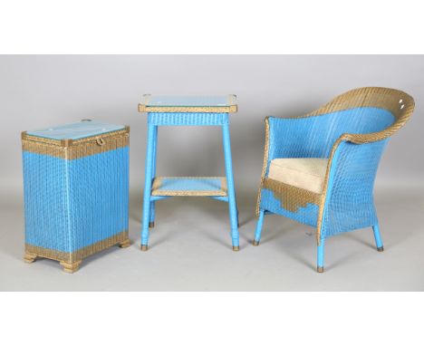An Art Deco Lloyd Loom table, height 71cm, width 47cm, a matching linen basket with silvered glass top and a matching tub bac
